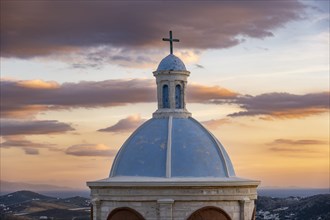 Blue dome of the Catholic Church of Our Lady of Mount Carmel at sunset