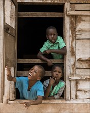 Medium shot african kids window