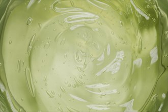 Flat lay green liquid wallpaper