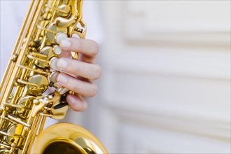 Close up held saxophone with blurred background