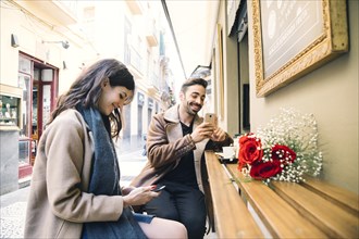 Couple browsing smartphones date