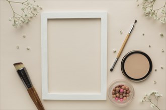 Frame with makeup products beside
