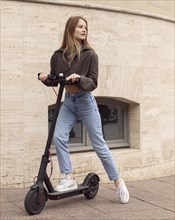 Woman electric scooter outdoors