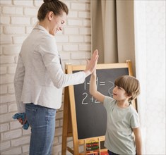 Side view tutor high fiving child home
