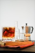 Hot espresso coffee in glass with cold tonic and ice