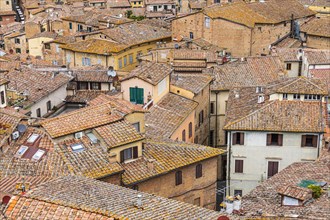 Above the roofs of the historic old town of Siena
