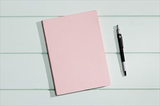 Pink cover notepad with pen