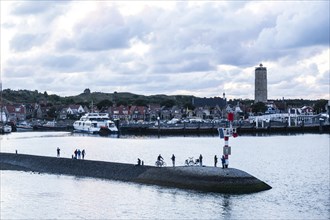 People in the harbour entrance of West on Terschelling