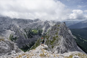 Mountaineer at the summit of the Waxenstein