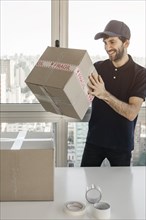 Delivery man packing parcel shipment clients