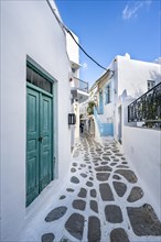 Cycladic white houses with colourful doors and shutters