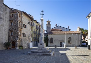 Monument Croce Del Patriarcato Gradese in the old town of Grado