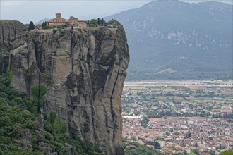 The Meteora Monastery Agia Triada Holy Trinity. The Greek Orthodox Meteora monasteries are built on sandstone cliffs above the Pinios valley. They are a UNESCO World Heritage Site. Kalambaka