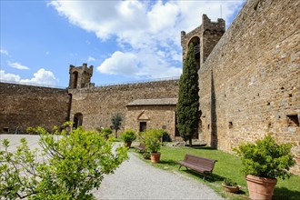 View from courtyard on fortification walls towers watchtowers of castle of Fortezza di Montalcino