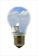 Cooling towers of nuclear power plant inside incandescent lamp