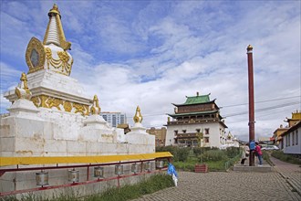 Stupa and Mongolians praying at pole