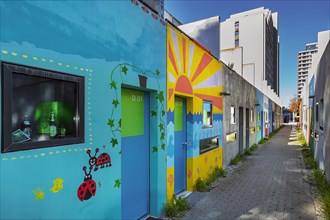 Olympic Village with painting on the former bungalows of the student village