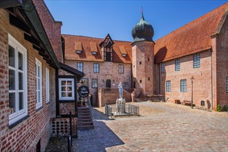 Inner courtyard with Roland statue of Bederkesa Castle in the mud spa