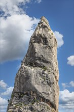 Climbers on the rock needle L'Aguglia at Cala Goloritze