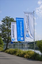 Flagpoles with flags of the Ruhrverband at the Harkortsee