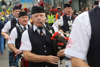 Bagpipers participating in the Fleadh Cheoil parade on the last day of Ireland's largest traditional music festival. Sligo