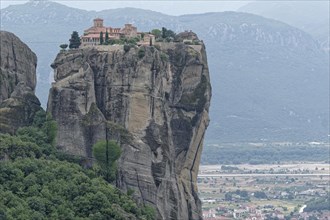The Meteora Monastery Agia Triada Holy Trinity. The Greek Orthodox Meteora monasteries are built on sandstone cliffs above the Pinios valley. They are a UNESCO World Heritage Site. Kalambaka