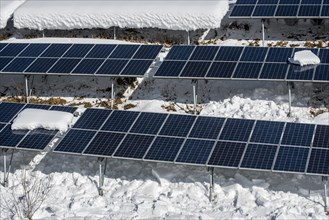 Solar panels in the snow in winter of photovoltaic power station
