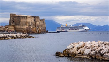 Castel dell'Ovo by the sea with cruise ship. Naples