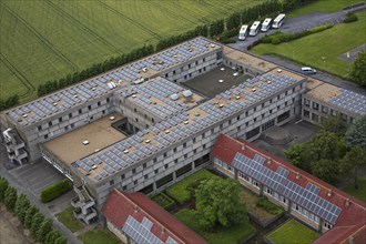 Photovoltaic solar panels on roof of office building