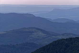 Evening mood over the mountain landscape of the Balkan Mountains and the forested slopes of the Balgarka nature park Park in Central Bulgaria. Shipka