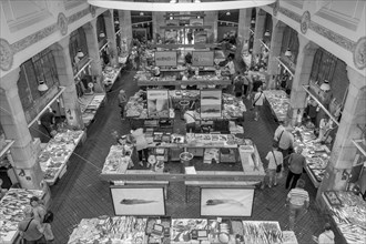 Black and white photo panorama of the hall from a bird's eye view of the stalls with crabs