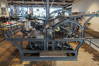 Late 19th century cast iron stop-cylinder press driven by steam engine made by H. Jullien at the Industriemuseum