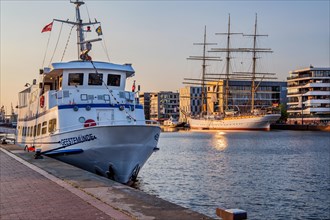 Excursion ship and sail training ship Germany in the New Harbour in the evening sun