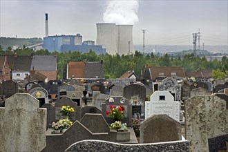 Cemetery and view over the Amercoeur powerplant in Roux