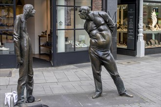 Two male statues confrontation by Karl-Henning Seemann