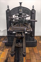 1820s cast iron printing press with wooden base made by Louis Gouy