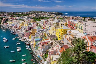 Panorama of the village with the church of Santa Maria delle Grazie and the fishing port in the bay of the fishing village of Corricella