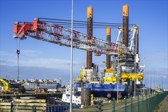 Offshore jack-up installation vessel Vole Au Vent with crane for assembling wind turbines moored at REBO heavy load terminal in Ostend port