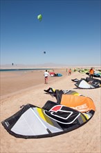 Kite sails lying on the beach on the Red Sea