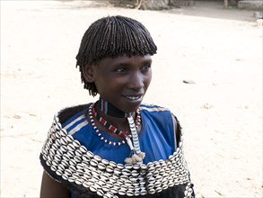 Woman with shell jewellery from the Tsamay tribe