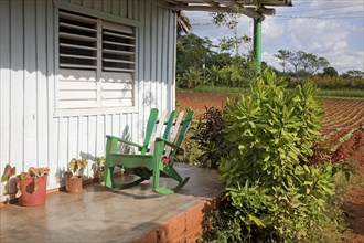 Rocking chair on porch of Cuban farmhouse in the Vinales Valley
