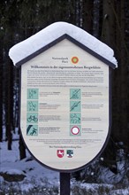 Information board in the snow in winter in the Harz National Park