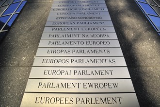 Nameplates of the European Parliament written in different European languages in the Leopold Quarter
