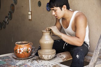 Potter in a pottery