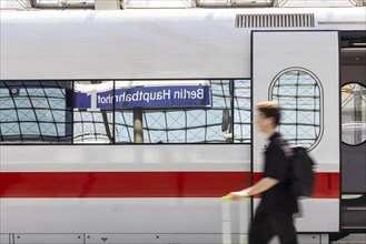 Platform with passengers and InterCityExpress of Deutsche Bahn AG