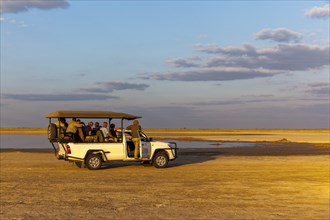 Safari Jeep with tourists at Salt Lake
