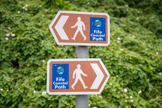 Signposts with pictograms on the Fife Coastal Path
