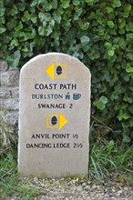 Stone signpost near Durston Castle on the Isle of Purbeck along the Jurassic Coast in Dorset