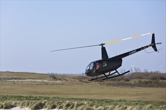 Helicopter over the island of Minsener Oog
