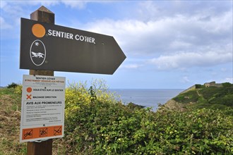 Signpost for footpath along the coast at Finistere